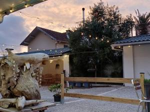 a wooden bench in front of a house at Le ptit Galet 462 in La Tremblade