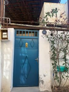 a blue door on the side of a building at Vintage Stile in Ganja