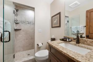 a bathroom with a sink and a toilet and a shower at Lakota Villa 607 Next to WP Resort I Private Hot Tub I Amazing Views I Activity Program in Winter Park +29 photos