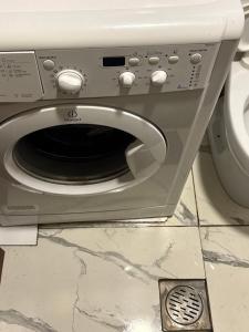 a close up of a toilet with a microwave at Green side in Ganja
