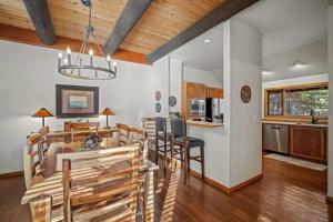 a kitchen and dining room with a table and chairs at 61 Wildflower in Sunriver