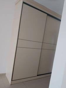 two sliding glass doors in a white wall at 海客瀛洲 Haïke-Îlezone in Abidjan