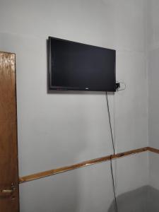 a flat screen tv hanging on a wall at La Damasca in General Roca