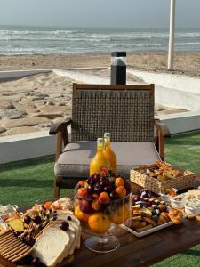 a table with a bunch of food on top of it at bh villa in Al Sharqiyah