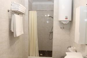 a bathroom with a shower and a toilet at Anna Mariya Villa in Kurortne +9 photos