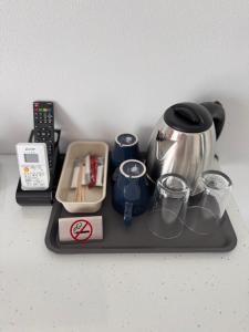 a tray with a coffee maker and a tea kettle at Danube Delta View in Dunavăţu de Jos