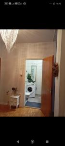 a bathroom with a sink and a washing machine at Karlskrona centrum in Karlskrona