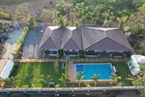 an aerial view of a house with a swimming pool at Eleven Eleven Villa in Pondicherry