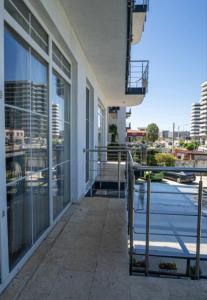 a balcony of a building with a view of a city at Marina Bay Beach Mamaia Nord in Mamaia Sat/Năvodari