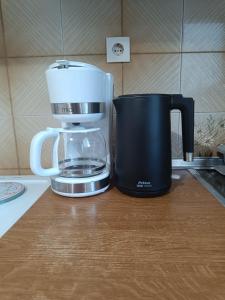 a coffee maker sitting on top of a counter at Plateia Home in Karditsa
