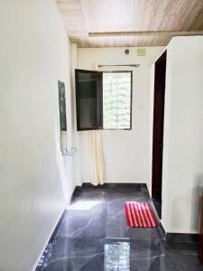 a room with a television and a tiled floor at Chandrachhaya Agro Farms Boisar in Boisar