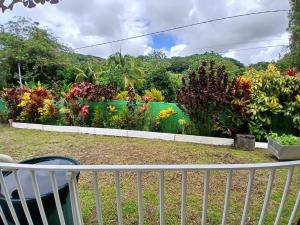 a garden view from the balcony at Résidence EmiRose in Rivière-Pilote