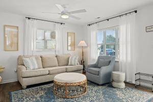 a living room with a couch and a chair at The Crabby Seahorse in Emerald Isle