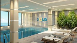 a rendering of a hotel lobby with a swimming pool at Sunny Spot Batumi in Batumi