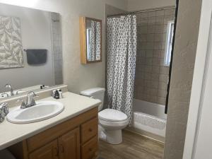 a bathroom with a sink and a toilet and a shower at Rustic Ridge in Granite Dells in Prescott +84 photos