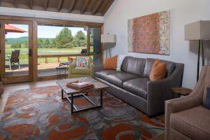 a living room with a couch and a table at 63 Meadow House in Sunriver