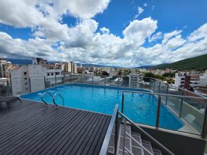 a swimming pool on the roof of a building at Caseros Centro Salta in Salta