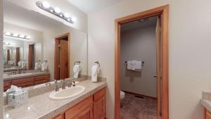 a bathroom with a sink and a mirror at 62 Wildflower in Sunriver