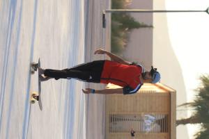 a man on a skateboard performing a trick on a wall at Surf sky tamraght in Agadir