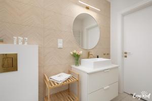 a bathroom with a white sink and a mirror at Baltic Harmony - Easy-Rent Apartments in Pobierowo +40 photos