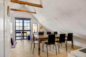 a dining room with a table and chairs at LN2056-Hjorring-Strandvejen-56 in Lønstrup