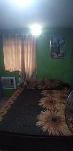 a bedroom with a large bed with a large dog on it at JK Hotels in Lagos