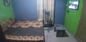 a bedroom with a bed with flowers on it at JK Hotels in Lagos