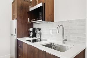a kitchen with a sink and a microwave at 18112-2 Forestbrook Loop in Bend