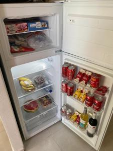 an open refrigerator filled with food and drinks at EL DESCANSO in Calpe
