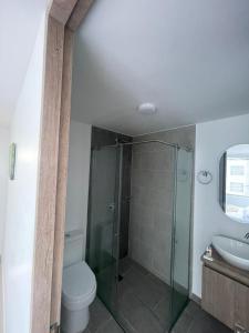 a bathroom with a shower and a toilet and a sink at Hotel Portal Del Cerro Manizales in Manizales +32 photos