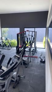 a gym with rows of exercise bikes in a room at Departamento completo y equipado con 2 habitaciones in León