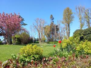 a garden with flowers and trees in a park at le bien l'authie in Colline-Beaumont +26 photos