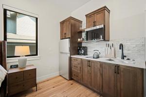 a kitchen with wooden cabinets and a white refrigerator at 18124-2 Forestbrook Loop in Bend