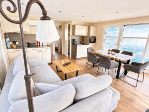 a living room with a couch and a table at Floatinghouse Möwe 2 - LP2 in Vetschau