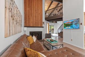 a living room with a couch and a fireplace at Twin Lakes in Rathdrum, ID in Rathdrum