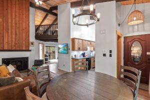 a dining room and living room with a wooden table at Twin Lakes in Rathdrum, ID in Rathdrum