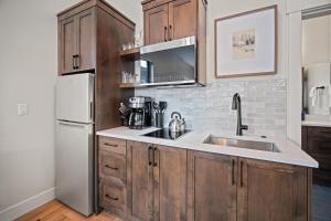 a kitchen with a sink and a refrigerator at 18129-2 Forestbrook Loop in Bend