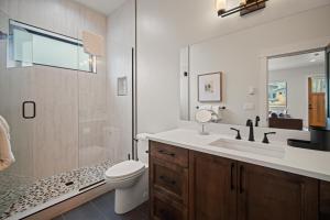 a bathroom with a sink and a toilet and a shower at 18129-2 Forestbrook Loop in Bend