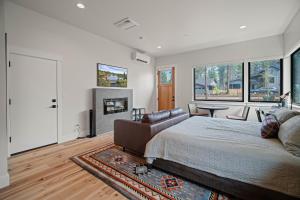 a bedroom with a large bed and a fireplace at 18129-2 Forestbrook Loop in Bend