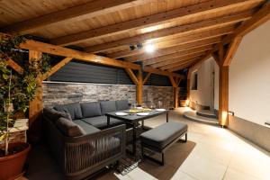 a living room with a couch and a table at HoUsE MILETIC in Solin