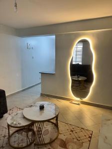 a room with two tables and a window at Serenity suites in Nairobi