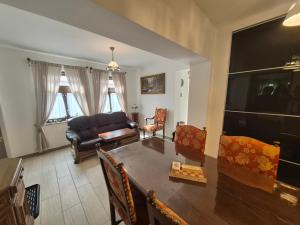 a living room with a couch and a table at Gerendás in Szilvásvárad