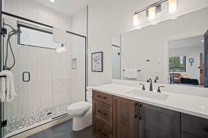 a bathroom with a sink and a toilet and a shower at 18136-2 Forestbrook Loop in Bend