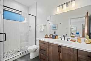 a bathroom with a sink and a toilet and a shower at 18145-2 Forestbrook Loop in Bend