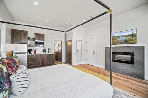 a bedroom with a large bed and a kitchen at 18145-2 Forestbrook Loop in Bend