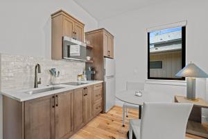 a kitchen with wooden cabinets and a table and a window at 18157-2 Forestbrook Loop in Bend