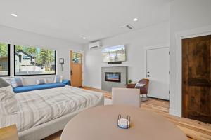 a living room with a bed and a fireplace at 18157-2 Forestbrook Loop in Bend +21 photos