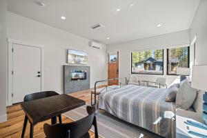a bedroom with a bed and a fireplace at 18163-2 Forestbrook Loop in Bend