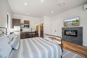 a bedroom with a bed and a kitchen at 18163-2 Forestbrook Loop in Bend