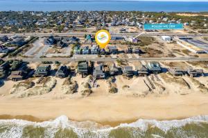 an aerial view of a beach with a street sign at 6129 - Lady Jane in Nags Head +61 photos